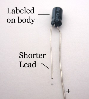 Capacitor polarization markings